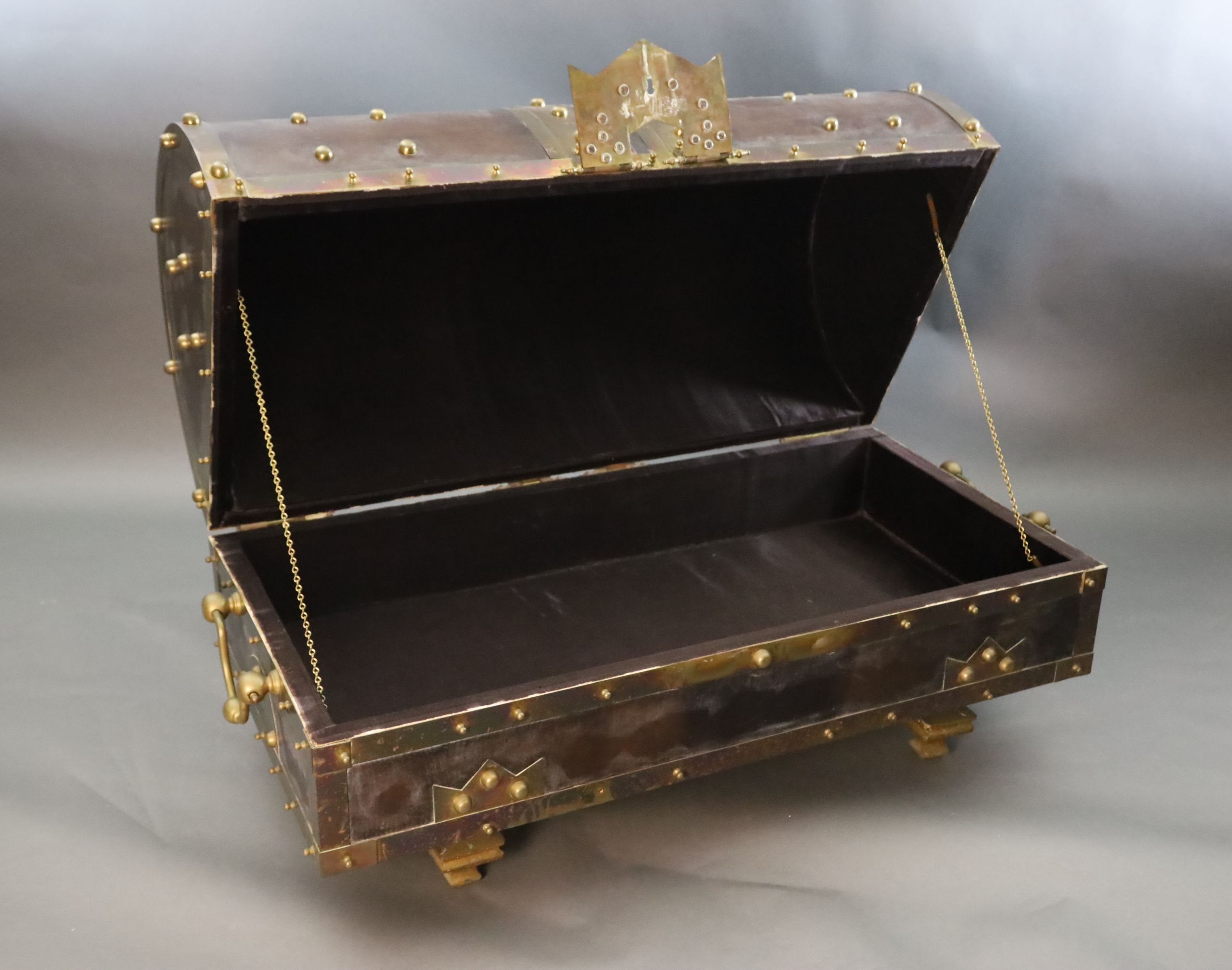 An ormolu and brass mounted leather dome top coffer,